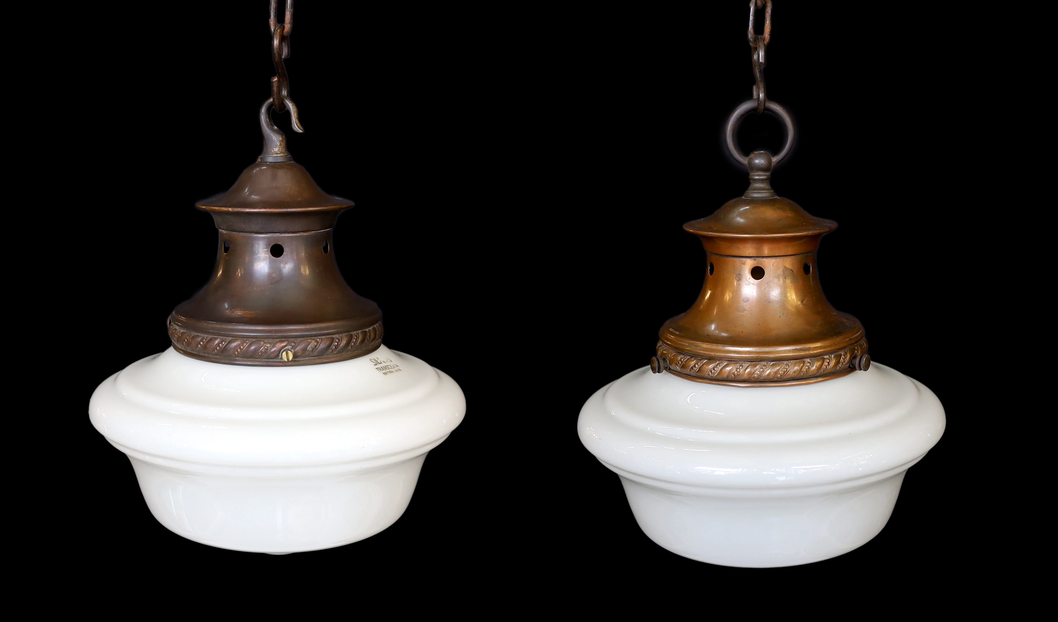 A pair of 1930s English copper ceiling lights with a Siemens Transcenda opaque glass shades, height 29cm